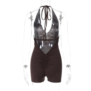 Detailed back view of deep brown halter neck romper with ruched backless design