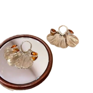 Silver needle crystal petal tassel hoop earrings with amber stones in layered fan design