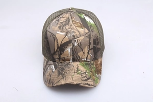Detail of woodland camouflage baseball cap featuring breathable mesh and curved sun visor