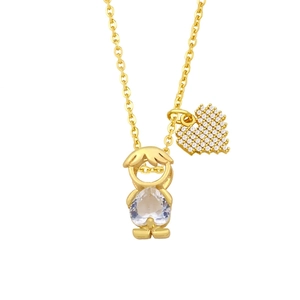 Detail of gold necklace with a zircon boy pendant and a pixel heart charm