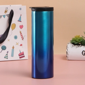 Close-up of blue-cyan gradient stainless steel vacuum tumbler with black lid on a desk
