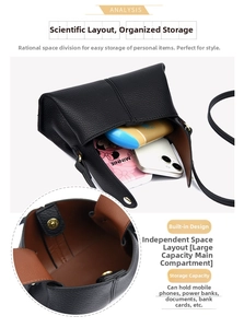 Detail view of black lychee leather crossbody bag showing internal capacity and magnetic closure