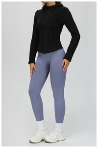 Slim-fit black hooded zip-up jacket paired with lavender leggings for outdoor sports