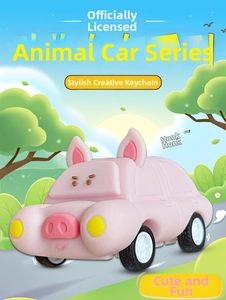 Close-up of a cute pink pig-shaped toy car keychain with white wheels and round body