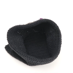 Black knit cat ear beanie with daisy pattern and honeycomb texture for winter warmth