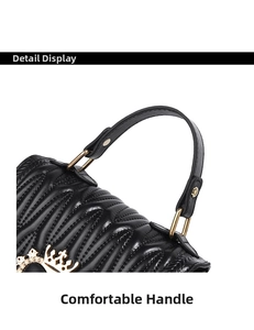 Detail of black quilted bucket bag featuring a gold crown buckle and comfortable leather handle