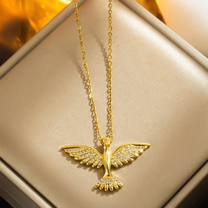 Golden phoenix wing pendant necklace with sparkling cubic zirconia on a minimalist chain