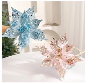 Sparkly pink and blue artificial velvet poinsettia flowers for Christmas tree decoration