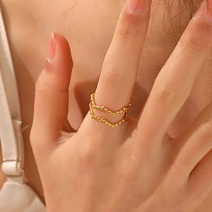 18K gold-plated stainless steel ring with double-layer wave pattern and bead details