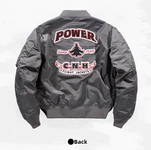 Back view of gray bomber jacket with detailed power embroidery and fighter jet graphics