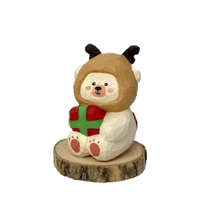 Handcrafted white bear wood carving decor with reindeer hat and red gift box on wood base