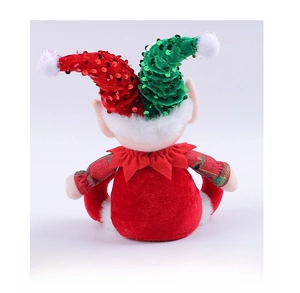Back view of sitting Christmas elf doll with red and green sequin hat and velvet clothes