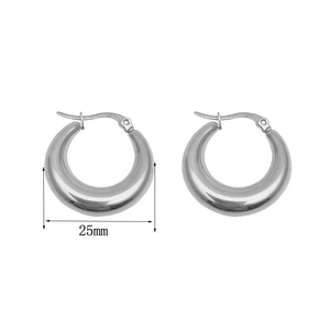 Close-up of polished silver hoop earrings with 25mm diameter on a white background