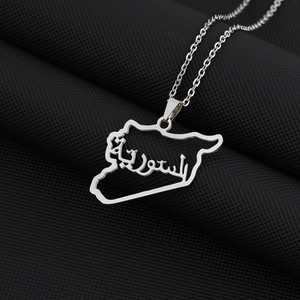 Macro view of silver titanium steel necklace featuring Syria map pendant with Arabic calligraphy