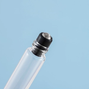 Transparent glass roller bottle for perfume and essential oils with a sleek black cap