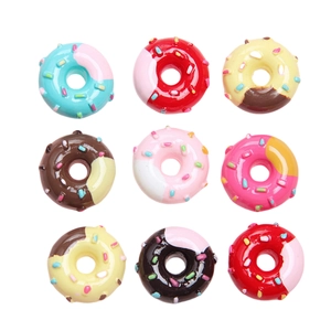 Set of 9 colorful resin donuts for DIY accessories with sprinkles on white background