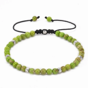 Close-up of 4mm green natural stone beads with silver spacers on adjustable woven cord