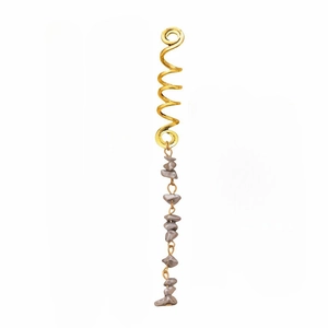 Detailed shot of golden spiral metal clip with irregular grey stone beads tassel