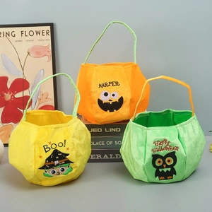 Three plush Halloween candy bags featuring embroidered witch, pumpkin, and owl motifs