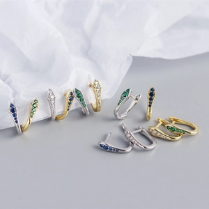 Detailed macro view of S925 silver snake hoop earrings with colorful zircon stones