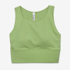 Dettaglio del reggiseno sportivo verde che mostra il tessuto in nylon e le spalline larghe