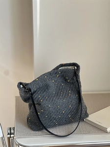 Detail of dark grey wool blend tote bag with colorful specks and thick textured fabric