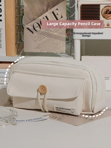 Detail showing high-capacity canvas pencil case with multi-compartments and button pocket