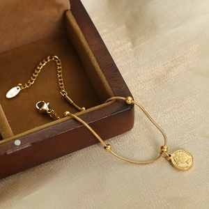 British retro 18K gold-plated titanium steel chain bracelet with embossed coin pendant