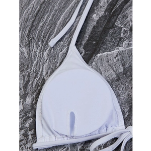 Detail view of white bikini top showing inner cup lining and removable pad slots