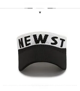 Detailed close-up of knitted sun visor featuring black and white contrast with NEW ST lettering