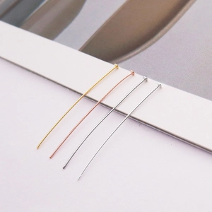 Macro shot of S925 sterling silver DIY jewelry pins in gold, rose gold and silver finishes