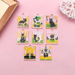 Detailed collection of eight black cat tarot enamel charms on a pink background