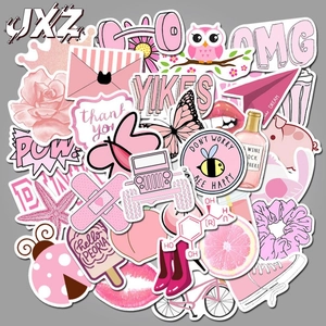 Flat lay of cute pink aesthetic stickers featuring flowers, owls, and butterflies