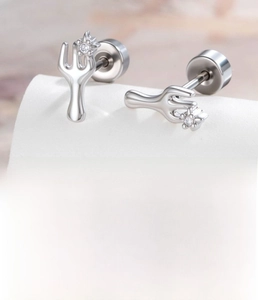 Macro shot of silver fork shaped stud earring with zircon inlay and product specifications