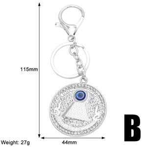 Detailed view of Tree of Life evil eye keychain with rhinestones and size dimensions
