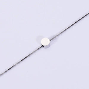 Polished 316L stainless steel necklace with a minimalist round ball pendant on white background
