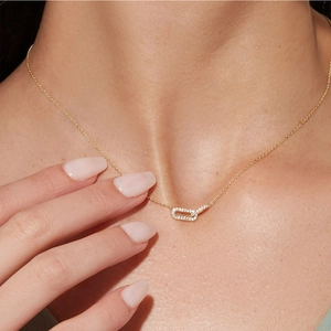 Interlocking double oval hoop pendant necklace with pavé diamonds in gold plating