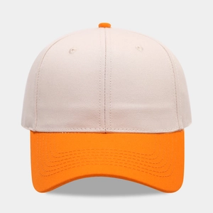 Close-up of contrast stitching on two-tone cotton baseball cap brim and panels