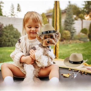 Detail of khaki felt pet cowboy hat with star buckle belt and adjustable strap