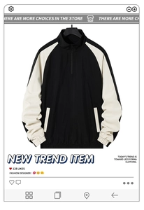 Detail der schwarz-cremefarbenen Sportjacke mit Stehkragen und halbem Reißverschluss-Design