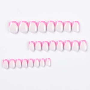 Short pink French gradient press on nails with round tips and a glossy finish