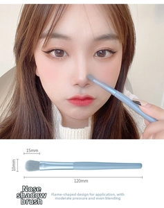 Detailed view of flame-shaped nose shadow brush with blue handle and size specifications