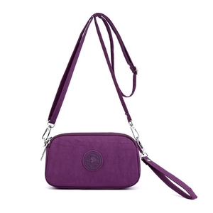 Multipurpose purple nylon crossbody bag with adjustable strap and Smile Way logo