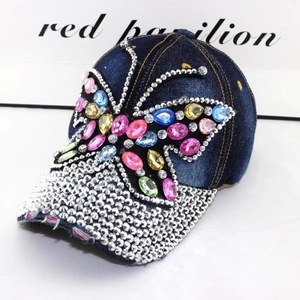 Denim baseball cap with colorful rhinestone butterfly and distressed brim detail