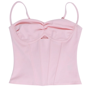 Detail of light pink corset camisole featuring supportive boning and wave-edge cup design