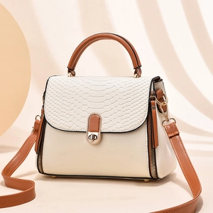 Mini cream and brown faux crocodile pattern crossbody handbag with golden hardware