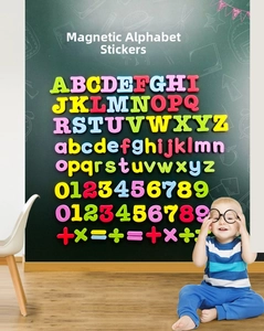 Detailed set of colorful magnetic alphabet letters and numbers on a green blackboard