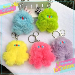 Cute plush monster bag charms in five colors with metallic keychains and embroidery