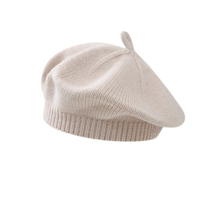 Classic beige knitted beret for infants featuring a soft wool blend and top stalk detail