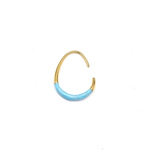 Detailed macro view of 18K gold-plated U-shaped earring with light blue enamel drip